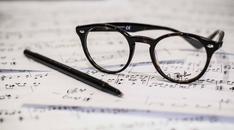 Music sheet music with eye glasses and pen